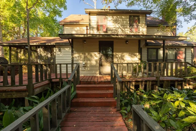 a view of a house with wooden stairs