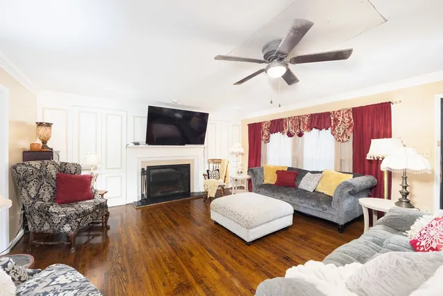 a living room with furniture fireplace and a flat screen tv