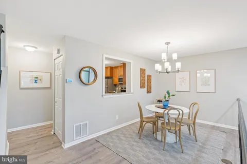 a view of a livingroom with furniture and hardwood floor