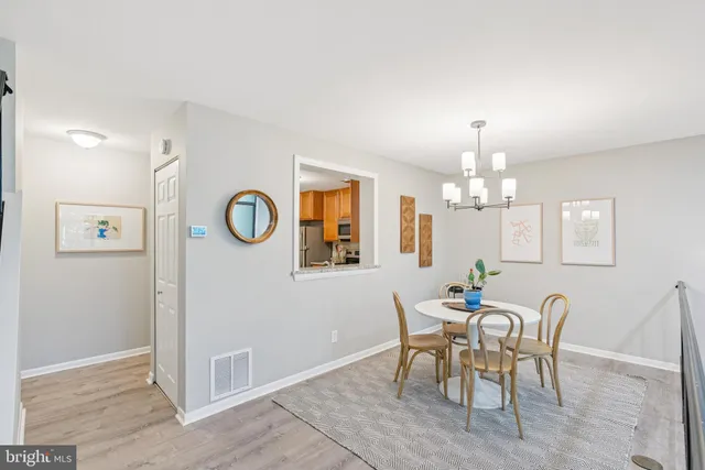 a view of a livingroom with furniture and hardwood floor