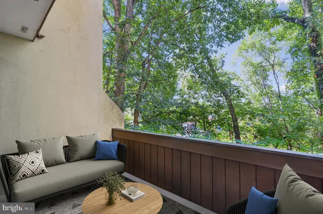 a utility room with cabinets washer and dryer