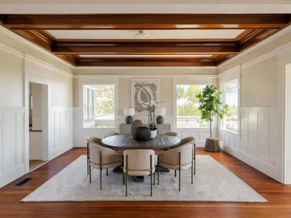 a dining room with furniture and window
