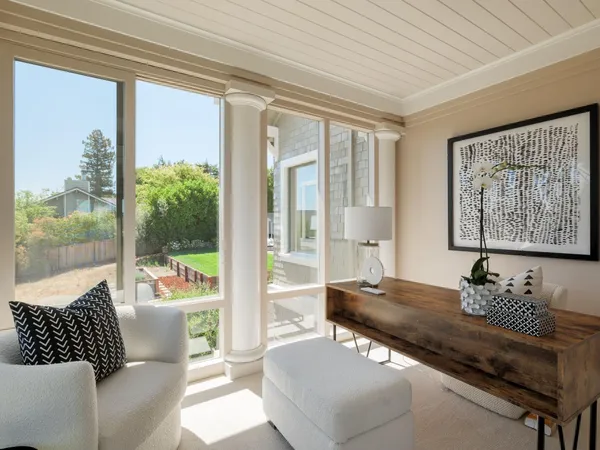 a living room with couch and a large window