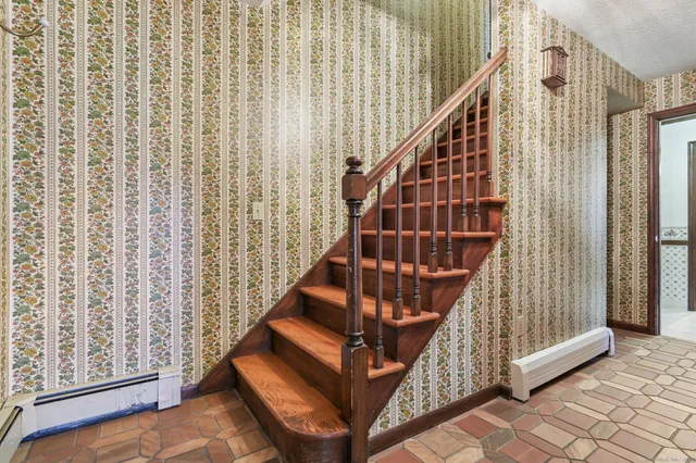 a view of entryway with wooden floor