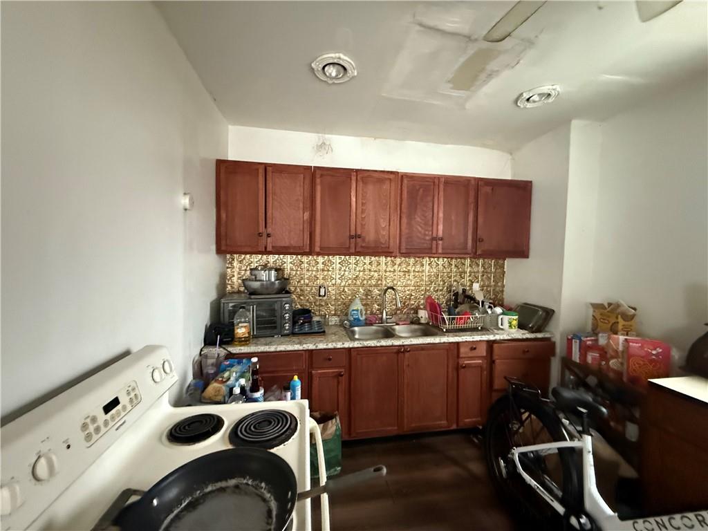 300 Hansen Avenue Butler, PA 16001 - Photo 6 of 10 a kitchen with a sink a stove and cabinets
