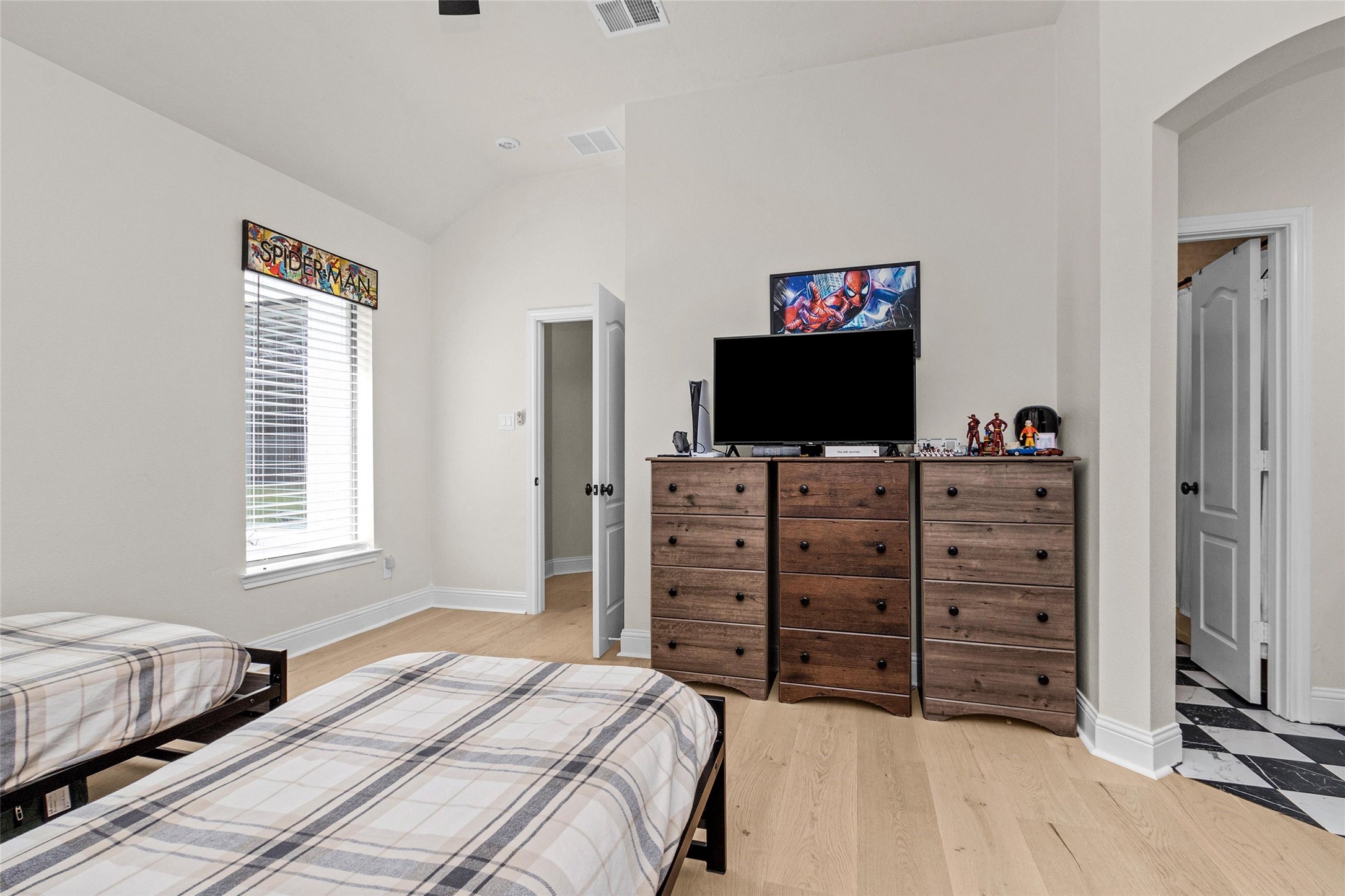 10004 Summer Ridge Lane Conroe, TX 77302 - Photo 41 of 50 a bedroom with a bed and a flat screen tv