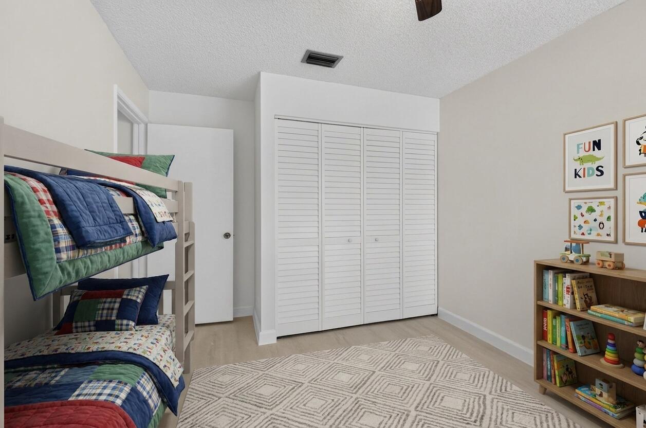 21070 Woodspring Avenue Boca Raton, FL 33428 - Photo 25 of 30 a view of walk in closet with clothes and shoes