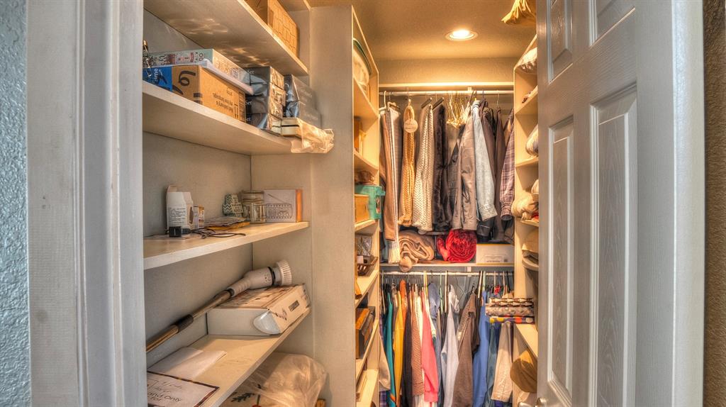 187 Roy Chisum Road Leakey, TX 78873 - Photo 16 of 40 a view of walk in closet with clothes and shoes