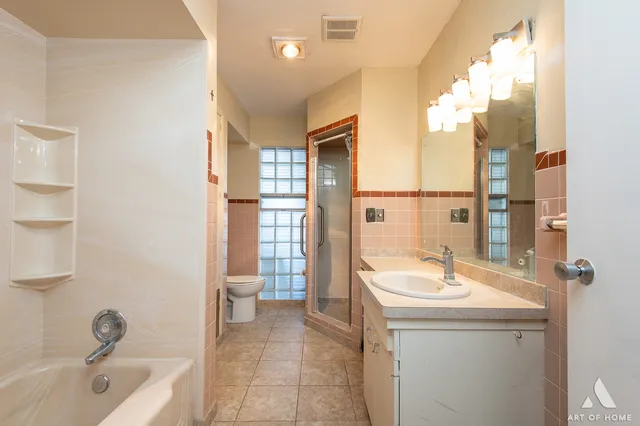 a bathroom with a sink a toilet and tub