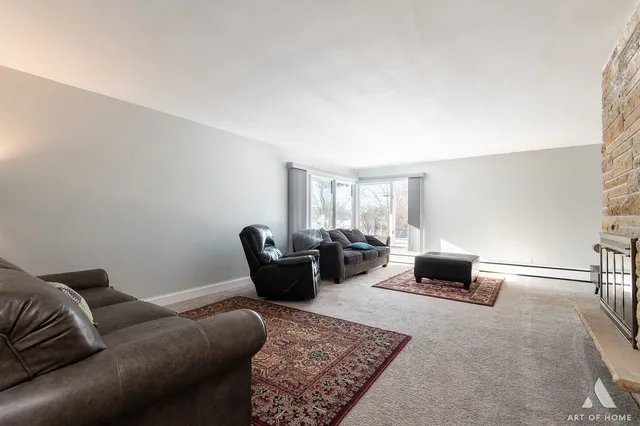 a living room with furniture and a rug