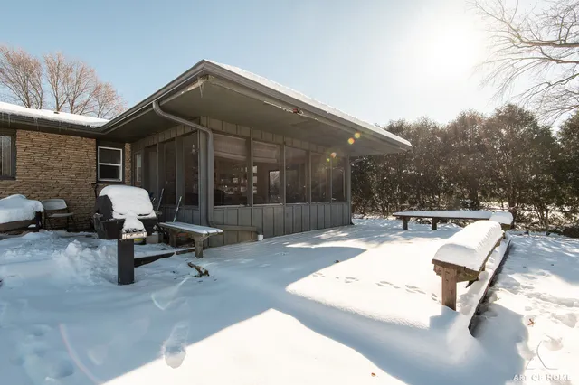 a view of a patio with a table and chairs