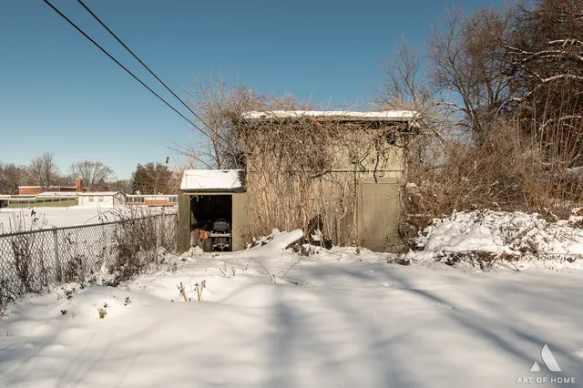 a view of snow on the side of road
