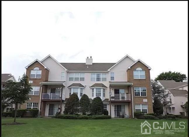 1412 Plymouth Road North Brunswick, NJ 08902 - Photo 1 of 18 a front view of a house with garden