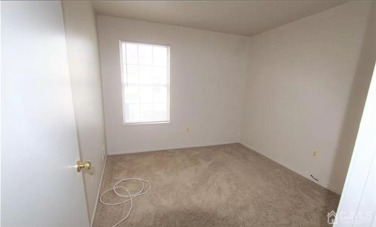 1412 Plymouth Road North Brunswick, NJ 08902 - Photo 11 of 18 an empty room with a window