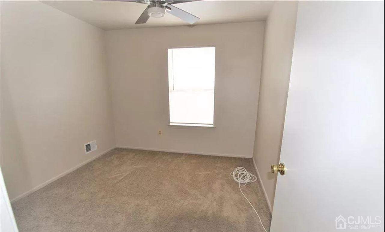 1412 Plymouth Road North Brunswick, NJ 08902 - Photo 14 of 18 an empty room with a window