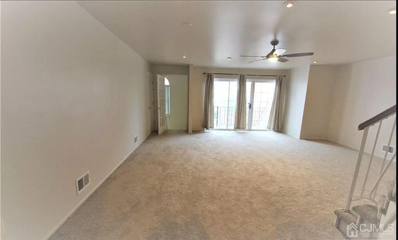 1412 Plymouth Road North Brunswick, NJ 08902 - Photo 4 of 18 a view of an empty room with a window