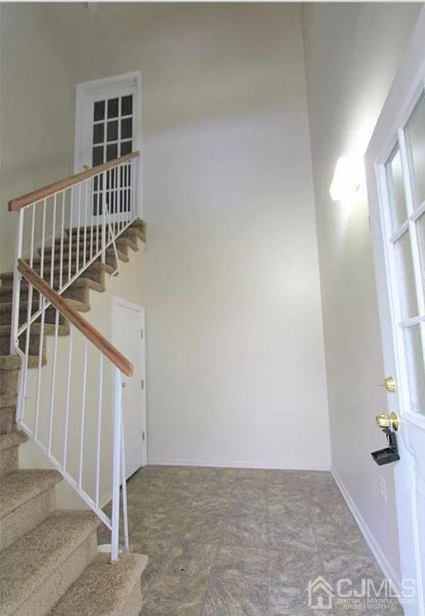 1412 Plymouth Road North Brunswick, NJ 08902 - Photo 5 of 18 a view of a hallway with wooden floor and entryway