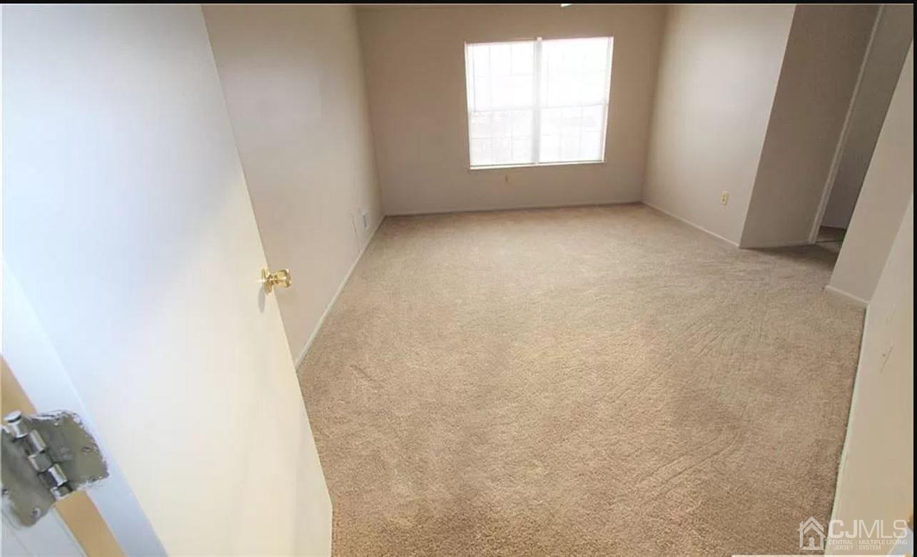 1412 Plymouth Road North Brunswick, NJ 08902 - Photo 6 of 18 an empty room with windows