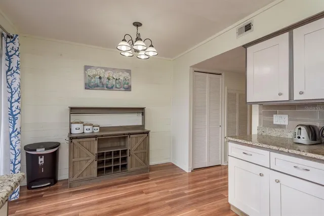 a view of kitchen and sink with wooden floor
