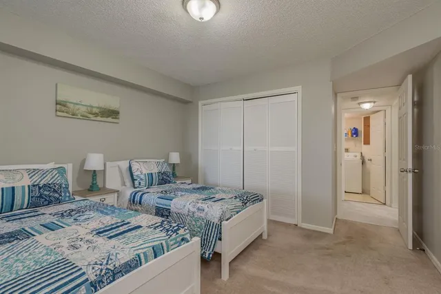 a bedroom with bed and a window