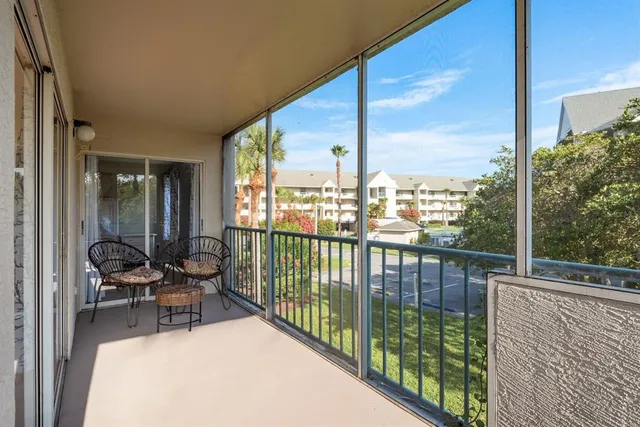 a balcony with chairs