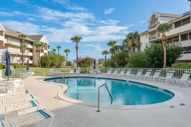 a view of a swimming pool with a patio