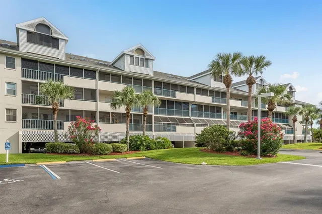 a view of a house with a yard and plants