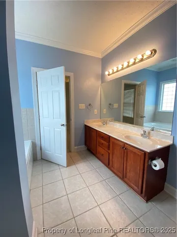 a spacious bathroom with a double vanity sink mirror and