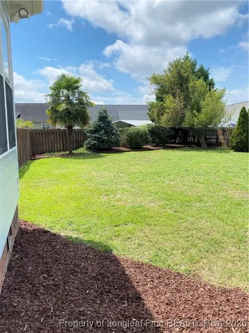 a view of a yard with an outdoor space