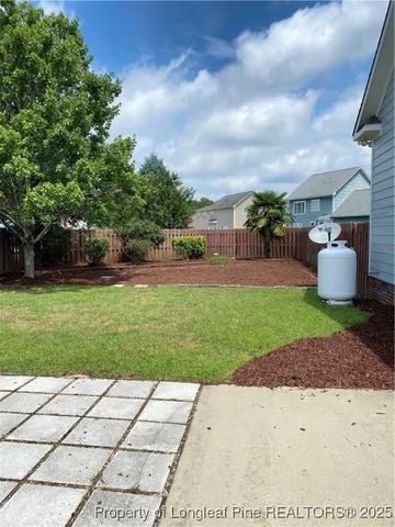a backyard of a house with lots of green space