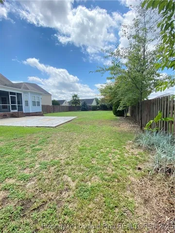 a view of a big yard with a house