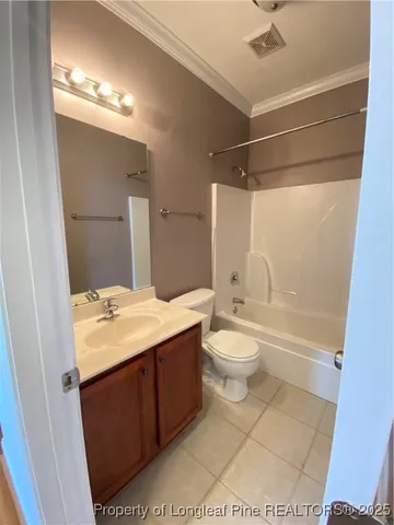 a bathroom with a granite countertop sink toilet a mirror and shower
