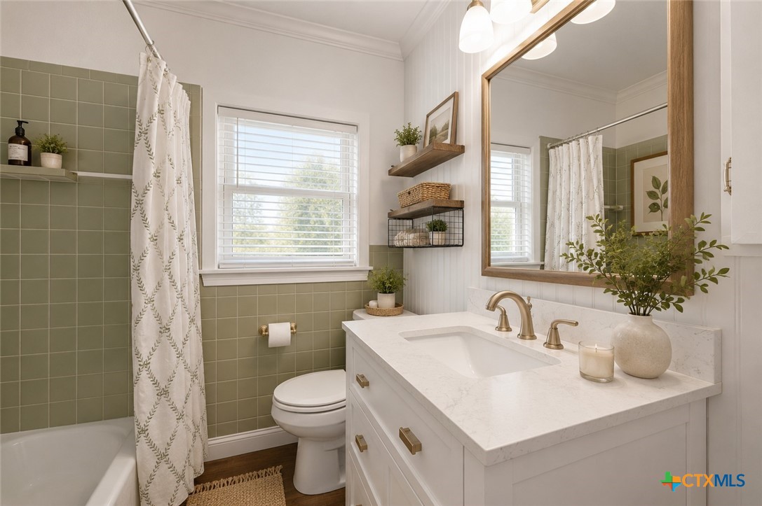102 Rivercrest Street Luling, TX 78648 - Photo 9 of 36 a bathroom with a sink toilet and shower