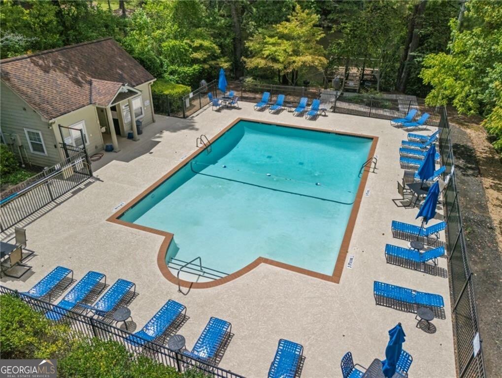 3650 Ashford Dunwoody Road Northeast, Unit 515 Atlanta, GA 30319 - Photo 2 of 14 an aerial view of a house with outdoor space