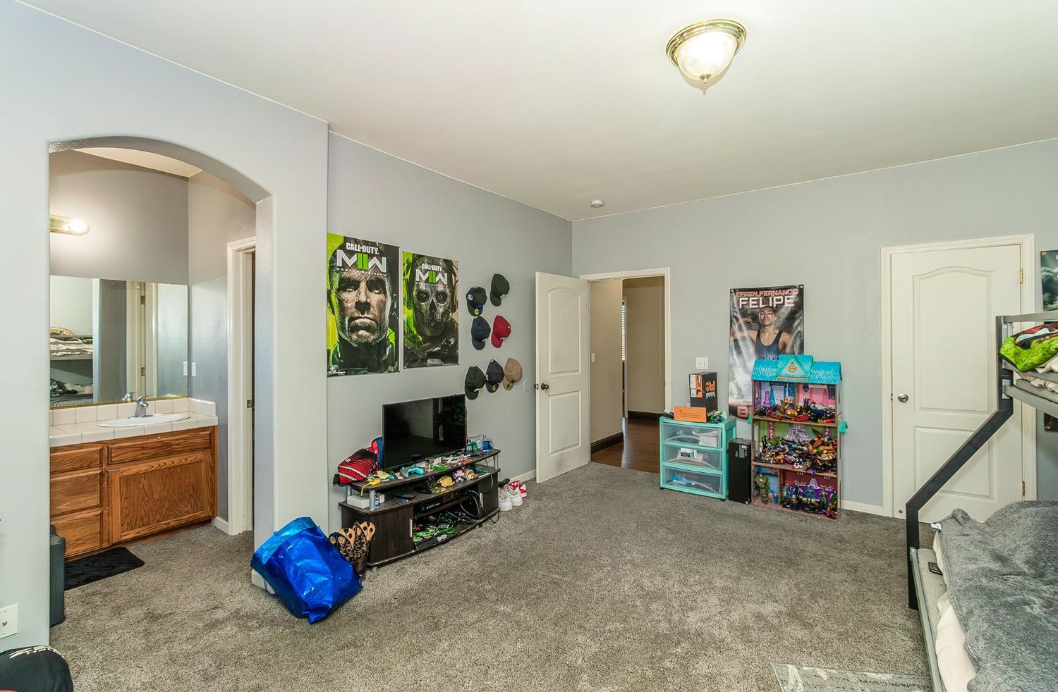 2666 Tammy Street Selma, CA 93662 - Photo 11 of 22 a living room with furniture and a flat screen tv