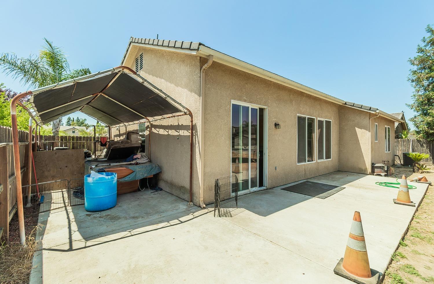 2666 Tammy Street Selma, CA 93662 - Photo 21 of 22 a patio with a table and chairs