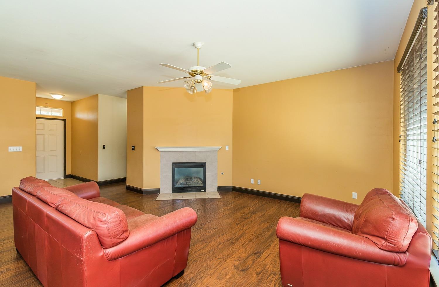 2666 Tammy Street Selma, CA 93662 - Photo 3 of 22 a living room with furniture and a fireplace