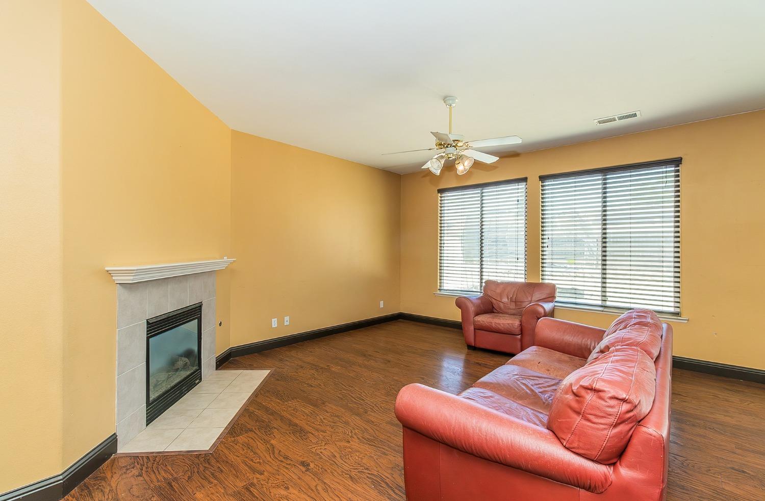 2666 Tammy Street Selma, CA 93662 - Photo 4 of 22 a living room with furniture and a fireplace
