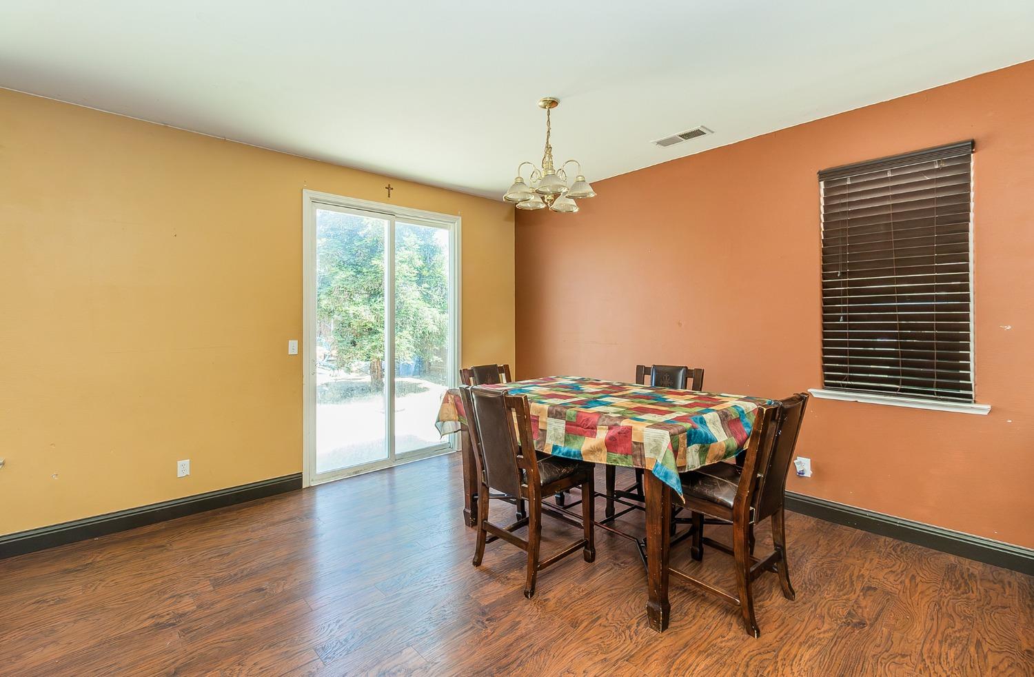 2666 Tammy Street Selma, CA 93662 - Photo 6 of 22 a view of a dining room with furniture window and wooden floor