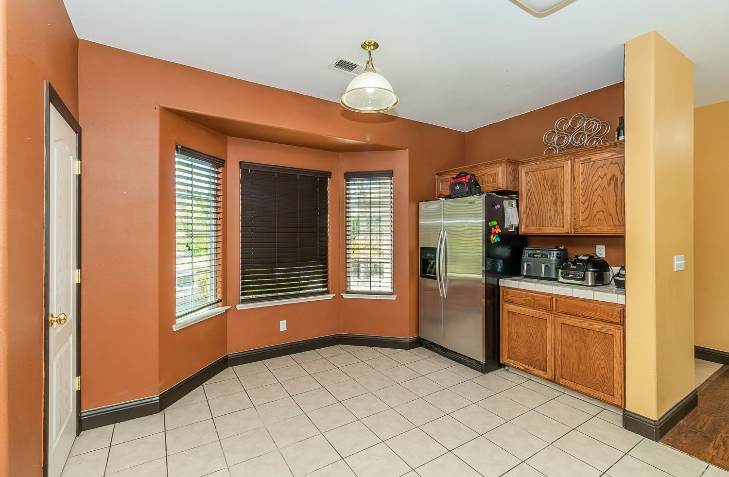 2666 Tammy Street Selma, CA 93662 - Photo 9 of 22 a kitchen with a refrigerator and a stove