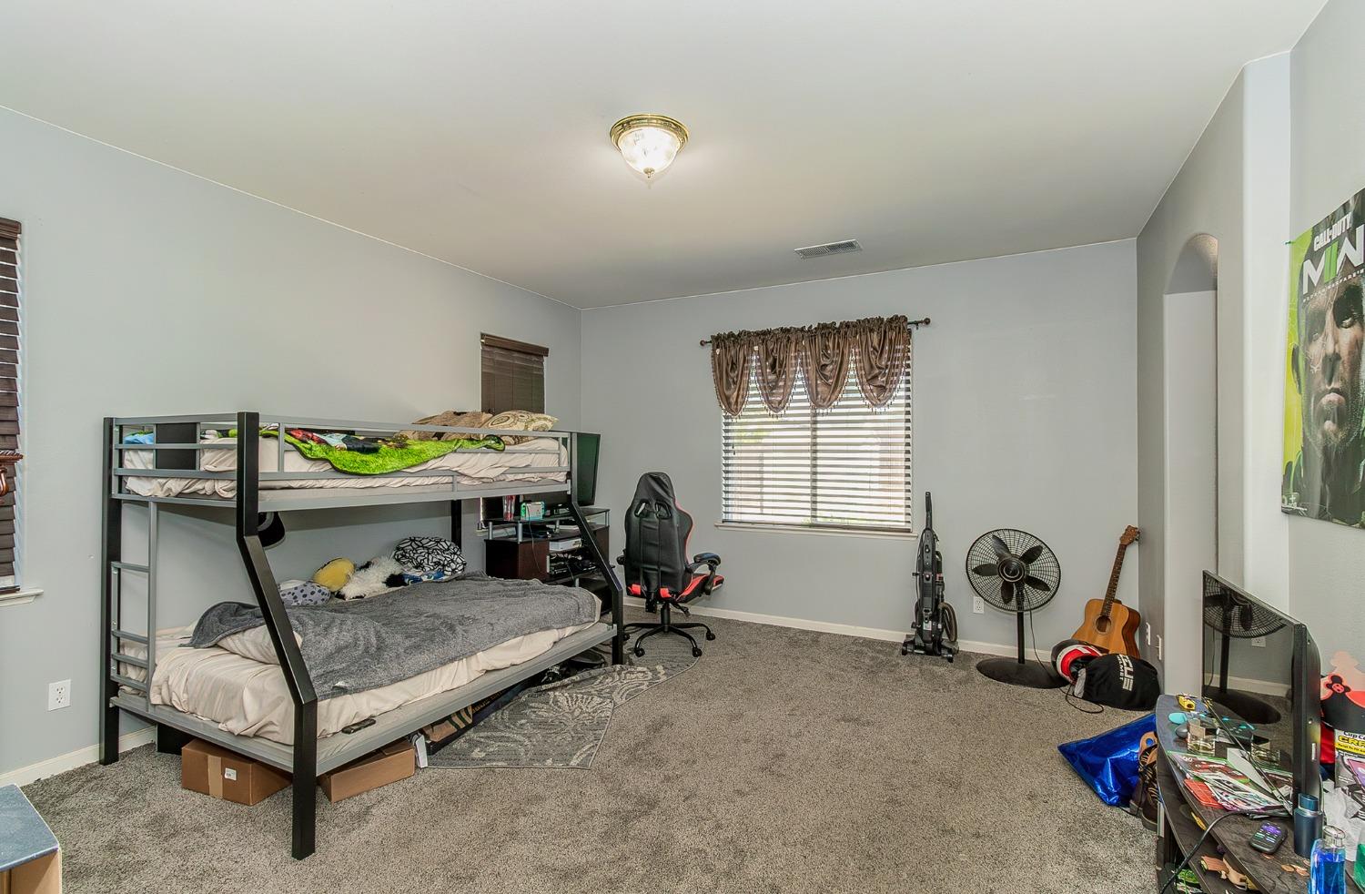 2666 Tammy Street Selma, CA 93662 - Photo 10 of 22 a bedroom with furniture and a window