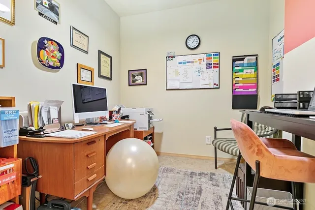 a view of a workspace with furniture