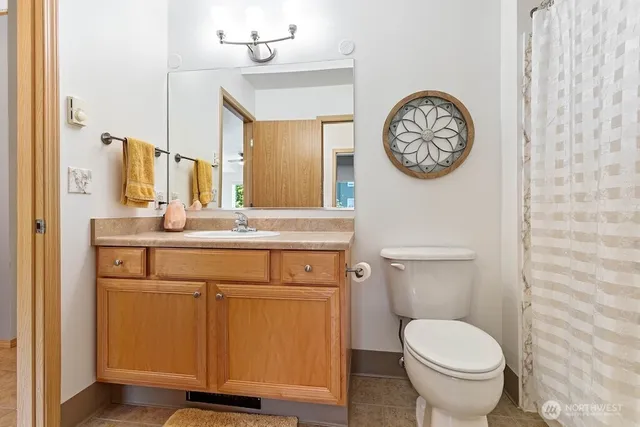 a bathroom with a toilet and a sink