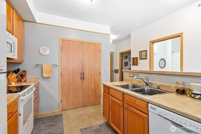 a kitchen that has a sink and a stove