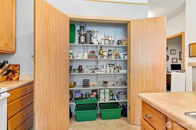 a living room with granite countertop lots of different kinds of food