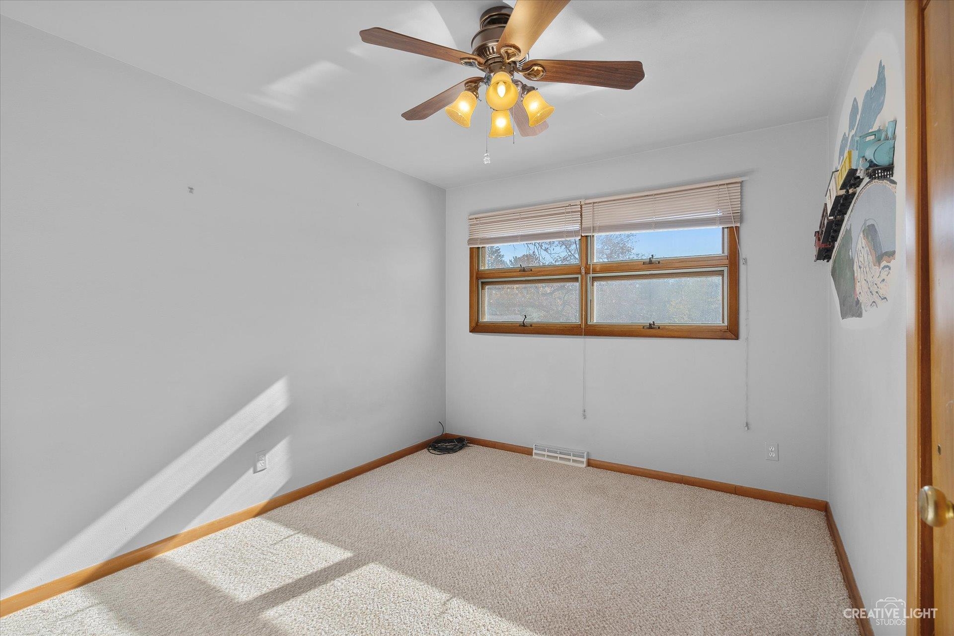 7927 Walnut Street Dixon, IL 61021 - Photo 13 of 33 a view of an empty room with a window