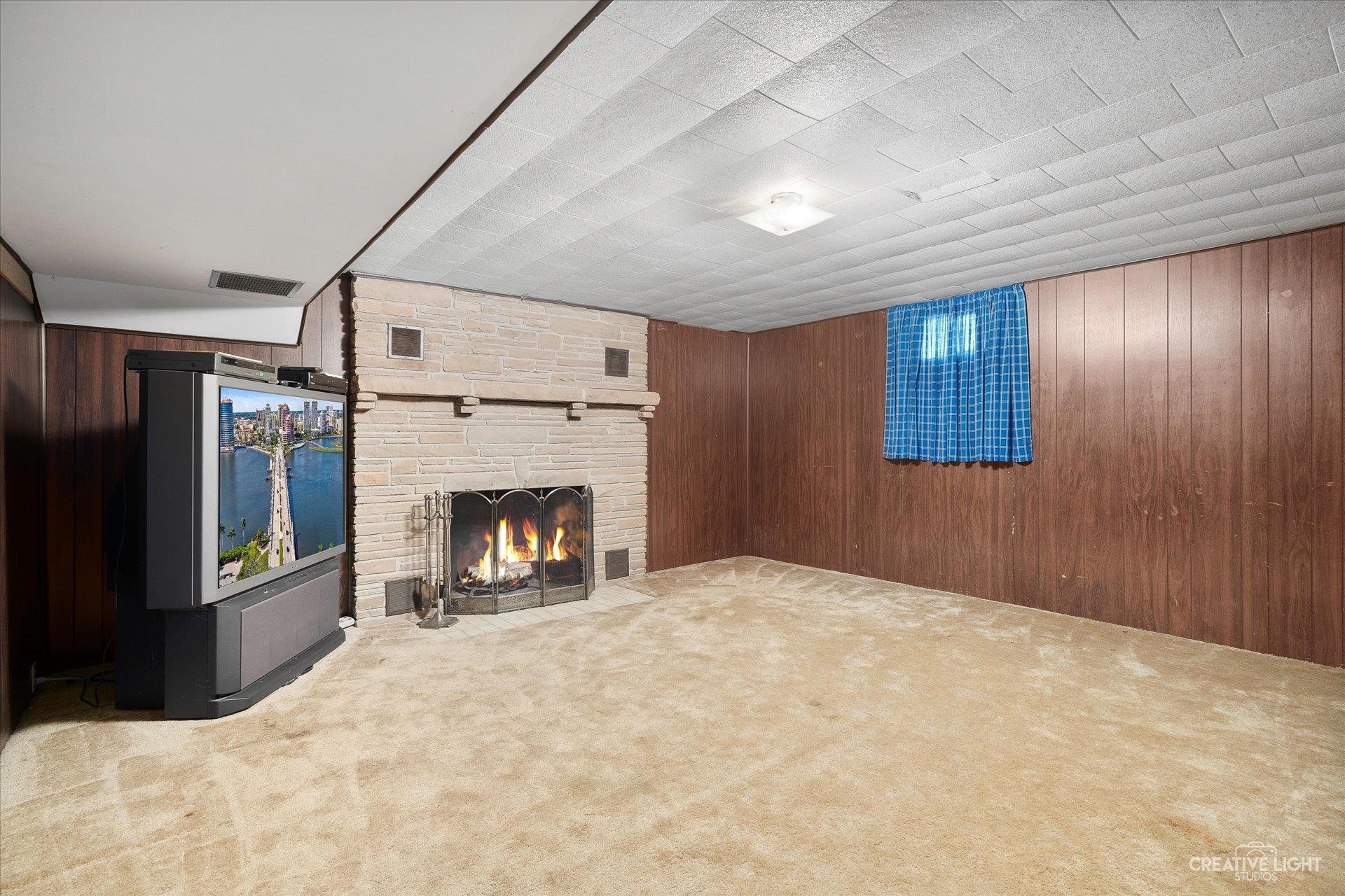 7927 Walnut Street Dixon, IL 61021 - Photo 19 of 33 a view of livingroom with fireplace and window