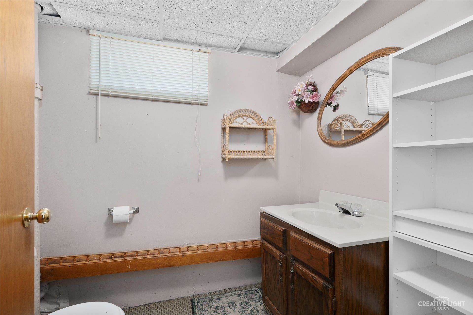 7927 Walnut Street Dixon, IL 61021 - Photo 20 of 33 a bathroom with a sink and a mirror