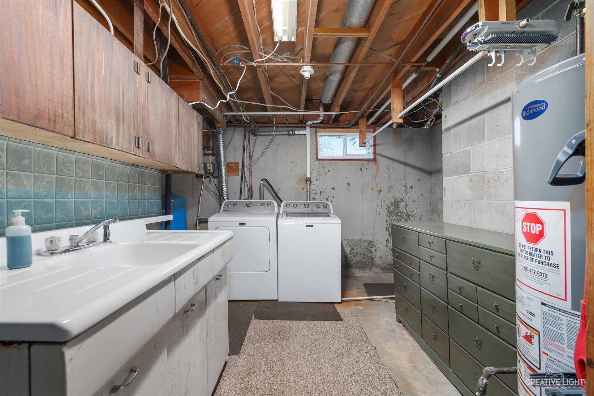 7927 Walnut Street Dixon, IL 61021 - Photo 21 of 33 a utility room with sink dryer and washer