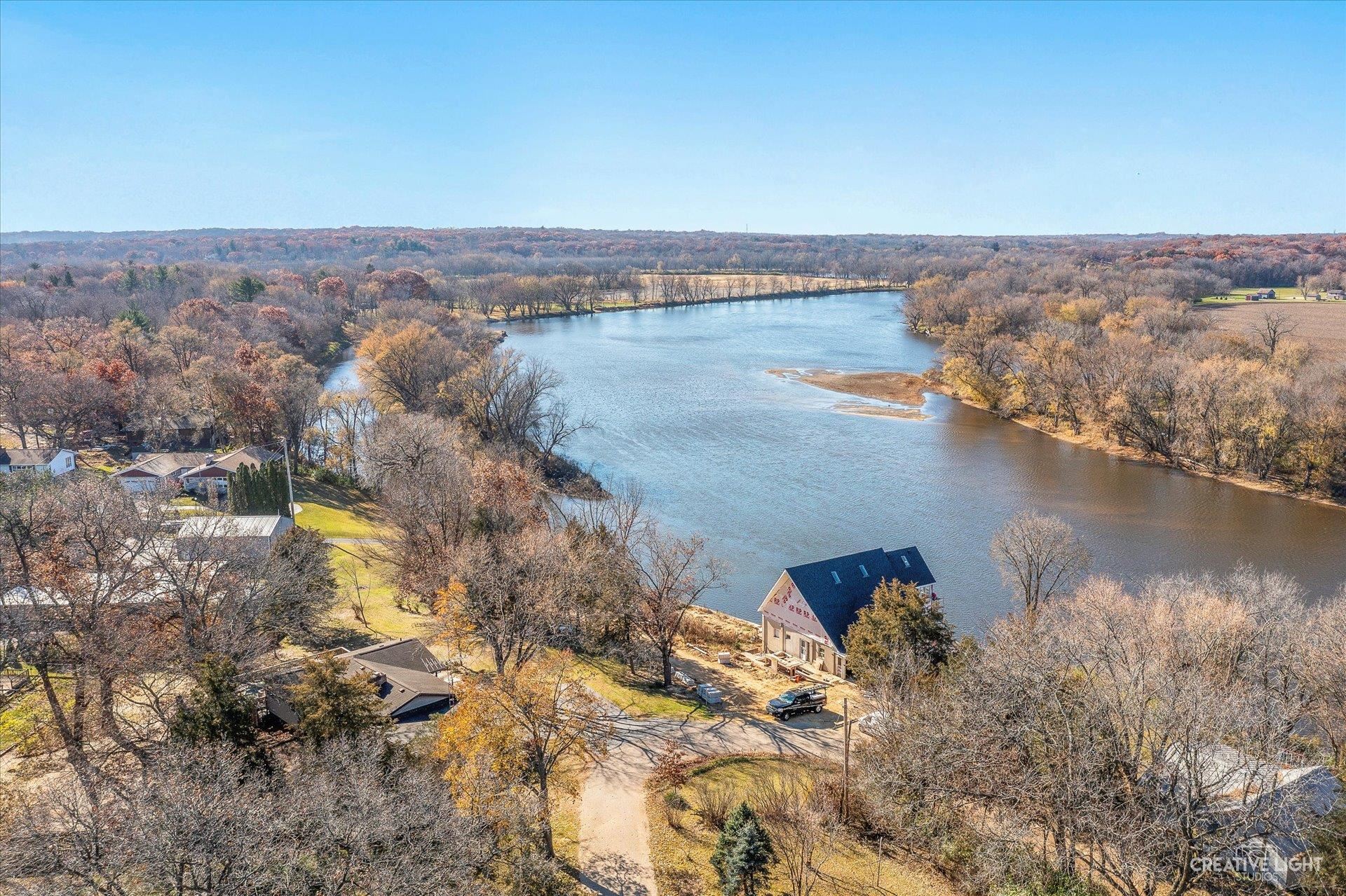 7927 Walnut Street Dixon, IL 61021 - Photo 27 of 33 an aerial view of residential building and lake